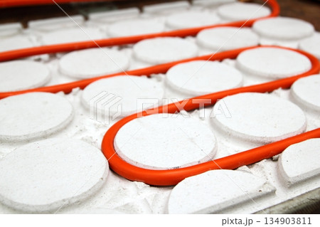 radiant floor heating tube red pipe curved circle pattern radiant floor heating tube red pipe curved circle pattern 134903811