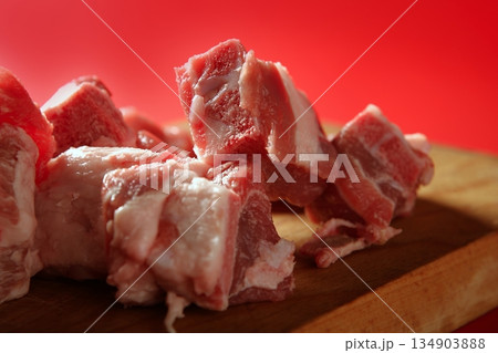 Pig, pork raw meat pieces over red Pig, pork raw meat pieces over red 134903888