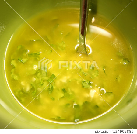 garlic, parsley, lemon and oil spanish sauce garlic, parsley, lemon and oil spanish sauce 134903889