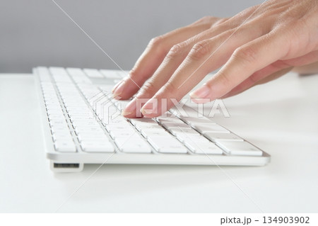 woman hands typing keyboard 134903902