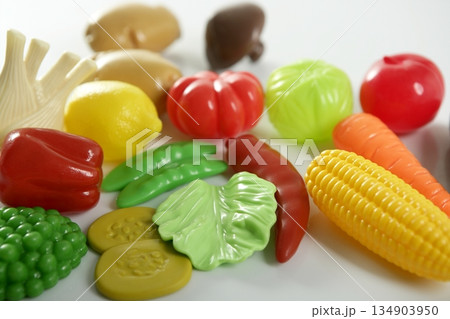 Plastic game, fake varied vegetables and fruits Plastic game, fake varied vegetables and fruits 134903950