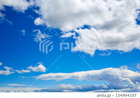 Blue sky with white clouds in a summer day Blue sky with white clouds in a summer day 134904107
