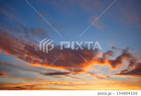 Sunset sky orange clouds over blue 134904108