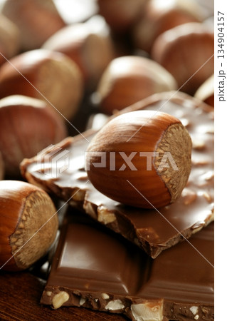 Hazelnuts and chocolate in brown enviroment 134904157