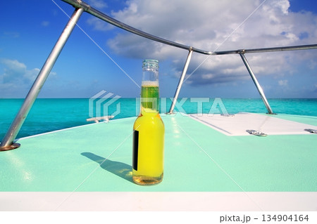 beer on Caribbean boat bow deck turquoise sea beer on Caribbean boat bow deck turquoise sea 134904164