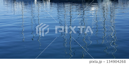 Boats abstract reflexion over blue water Boats abstract reflexion over blue water 134904268