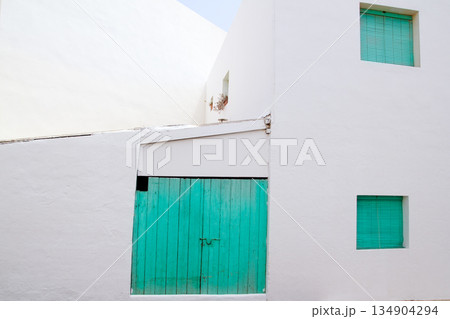 White house with green door in Formentera 134904294