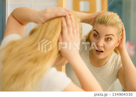 Female having problem with blonde hair Female having problem with blonde hair 134904330