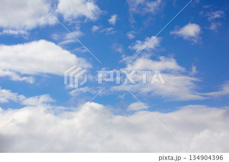 Blue sunny sky white clouds 134904396