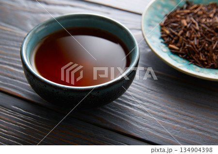 kukicha tea served in bowl 134904398