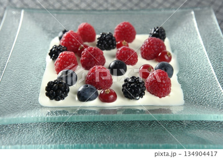 Mix of varied berries and cream 134904417