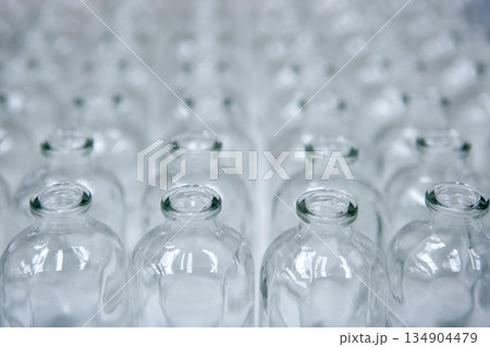 Glass transparent empty bottles assembly line 134904479