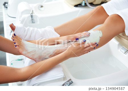 Aplying nourishing moisturizer mask woman legs Aplying nourishing moisturizer mask woman legs 134904587