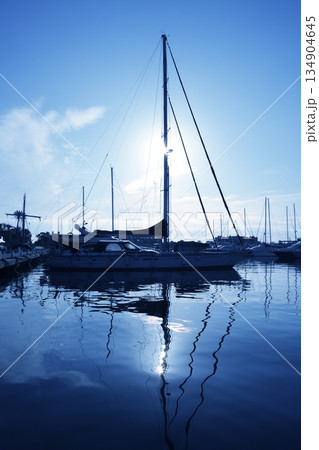 blue marina sunset boats with water reflection blue marina sunset boats with water reflection 134904645