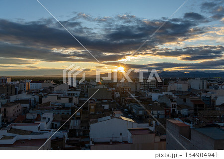 City skyline with urban buildings and sunset sky 134904941