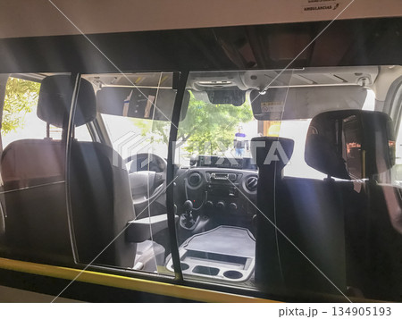 A van with a driver's seat and a passenger seat 134905193