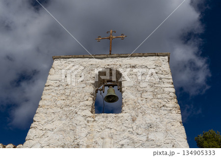 image of the bell tower of a hermitage with white walls standing out against the blue sky in the background image of the bell tower of a hermitage with white walls standing out against the blue sky in the background 134905333