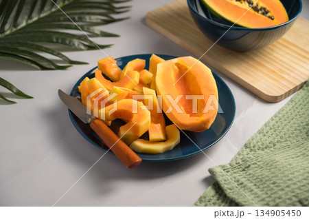 Papaya exotic fruits on plate. Healthy vegan food. 134905450