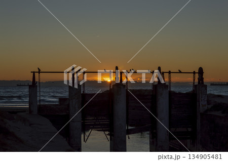 old locks at the mouth of the river on the shores of the Mediterranean Sea. Image at dawn old locks at the mouth of the river on the shores of the Mediterranean Sea. Image at dawn 134905481