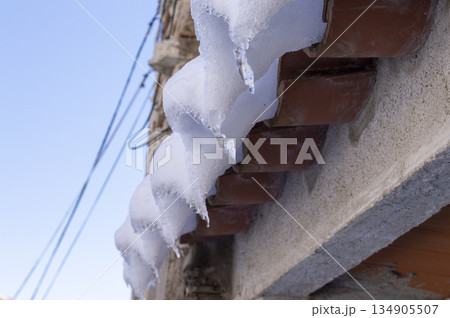 mud tiles in the foreground covered with ice and snow 134905507