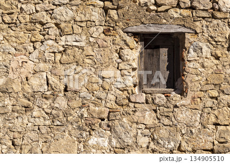 wooden window recessed in a stone wall wooden window recessed in a stone wall 134905510