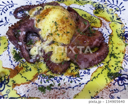 grilled octopus dish with garlic, oil and red pepper sauce 134905640