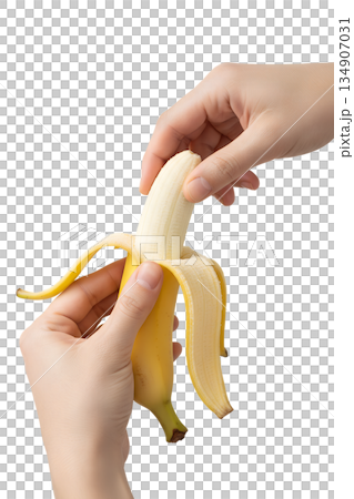 Hands peeling ripe yellow banana, isolated. Simple, healthy food image for snacks, diets, and nutrition themes 134907031
