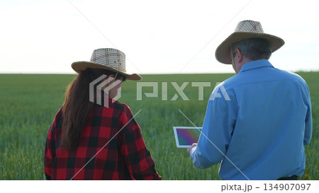Field inspection with tablet, Agricultural progress, High-tech farmers, Future of farming, Modern fieldwork tools, Farm digitalization, Explorers of agriculture, Farming in the 21st century, Efficient Field inspection with tablet, Agricultural progress, High-tech farmers, Future of farming, Modern fieldwork tools, Farm digitalization, Explorers of agriculture, Farming in the 21st century, Efficient 134907097
