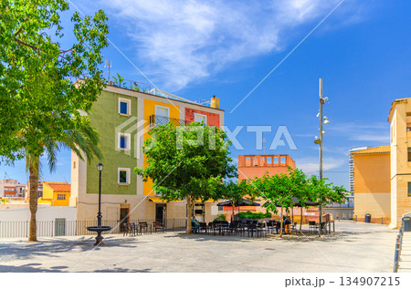 Multicolored building and street restaurant outdoor cafe on Plaza del Puente square 134907215
