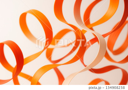Orange curved paper ribbons on a light background. 134908238