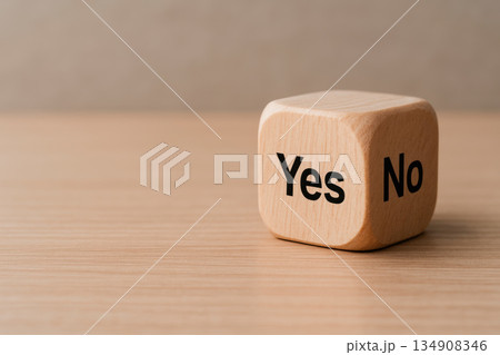 A voting cube with the words yes and no. Space for text. A voting cube with the words yes and no. Space for text. 134908346