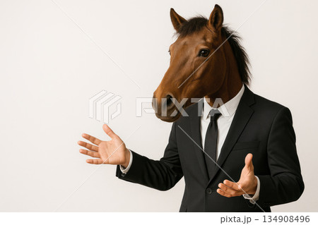 A man in a suit with a horse's head. Space for text. 134908496
