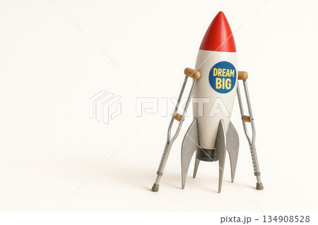 Rocket on crutches with the inscription Dream Big. Space for text. Rocket on crutches with the inscription Dream Big. Space for text. 134908528