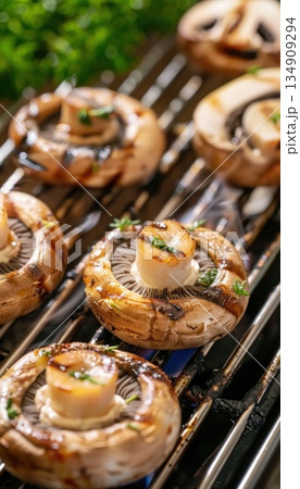 Food Mushrooms on skewers being grilled on a grill 134909294