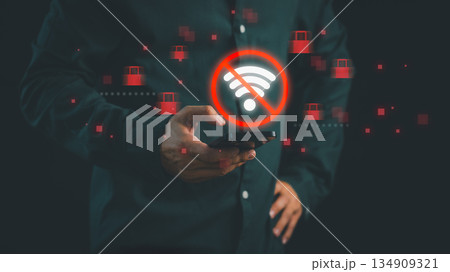 Person holding smartphone with glowing no Wi-Fi symbol, representing internet connection error, network outage, Wi-Fi problem, cybersecurity risk, and mobile connectivity issues. Person holding smartphone with glowing no Wi-Fi symbol, representing internet connection error, network outage, Wi-Fi problem, cybersecurity risk, and mobile connectivity issues. 134909321