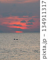 Sunrise and silhouette of a fisherman in the sea at Phuket city 134911317