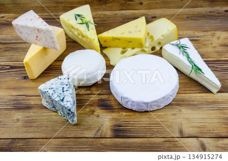 Set of various types of cheese on wooden table Set of various types of cheese on wooden table 134915274