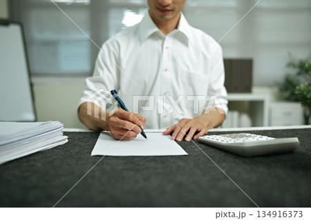 Audit concept,Bookkeeper or financial inspector and secretary making report Financial Planning Report in Spreadsheet Audit concept,Bookkeeper or financial inspector and secretary making report Financial Planning Report in Spreadsheet 134916373