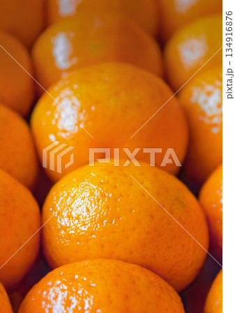 Fresh tangerines in boxes on the shelves of a grocery supermarket, tangerines on the shelves of a grocery store Fresh tangerines in boxes on the shelves of a grocery supermarket, tangerines on the shelves of a grocery store 134916876