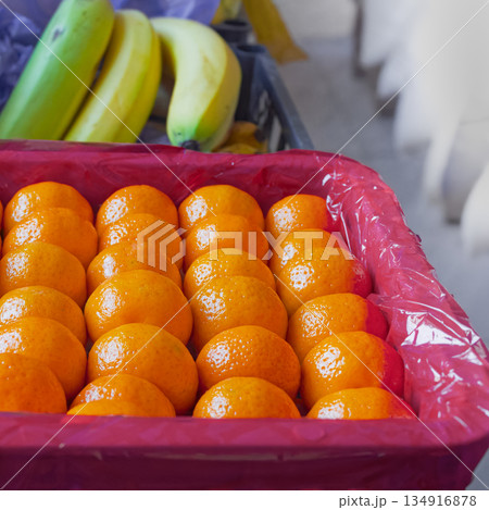 Fresh tangerines in boxes on the shelves of a grocery supermarket, tangerines on the shelves of a grocery store 134916878