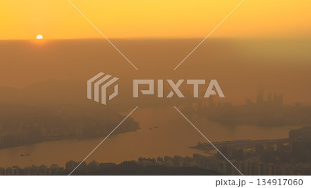 Hong Kong skyline glowing in warm golden light Dec 28 2025 134917060
