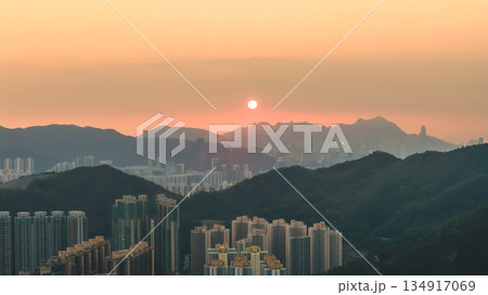 Hong Kong skyline glowing in warm golden light Dec 28 2025 134917069