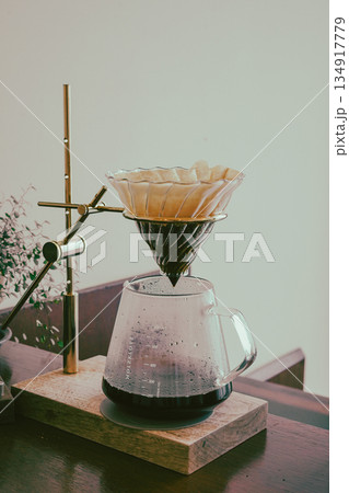 Hand Drip Coffee Extracting into Glass Server Hand Drip Coffee Extracting into Glass Server 134917779