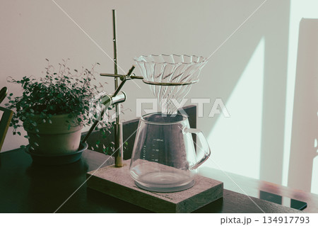 Clear Glass Coffee Dripper on Wooden Stand Clear Glass Coffee Dripper on Wooden Stand 134917793