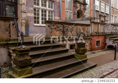 Historic staircase with decorative railing in a European city scene Historic staircase with decorative railing in a European city scene 134918153