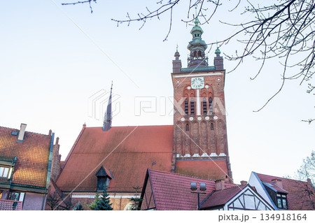 Historic tower and building in a city during late afternoon sunlight 134918164