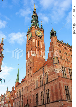 Tall clock tower in a city square on a sunny day showing historic architecture Tall clock tower in a city square on a sunny day showing historic architecture 134918170