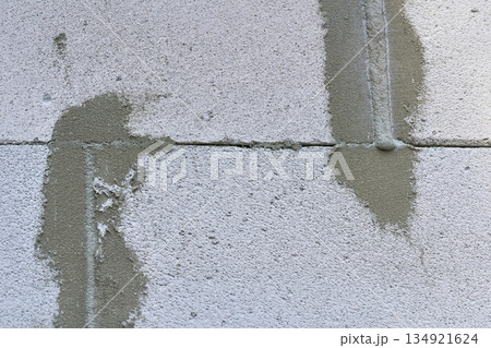Construction seam.Joint between two concrete blocks, sealed with cement Construction seam.Joint between two concrete blocks, sealed with cement 134921624
