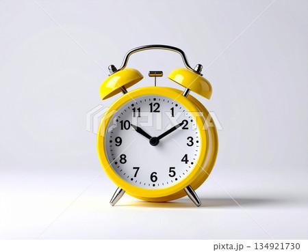 Deadline. Yellow metal alarm clock with yellow bells on pastel pink background. 134921730