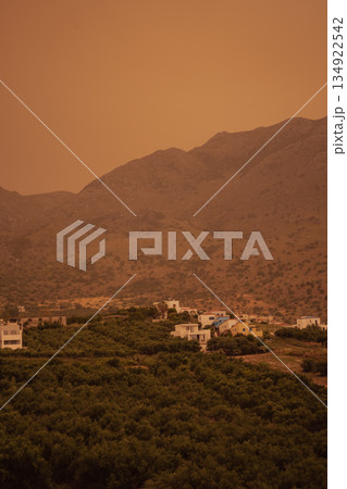 Meteorological event: african sand and poor visibility creating a dense orange haze over crete Meteorological event: african sand and poor visibility creating a dense orange haze over crete 134922542